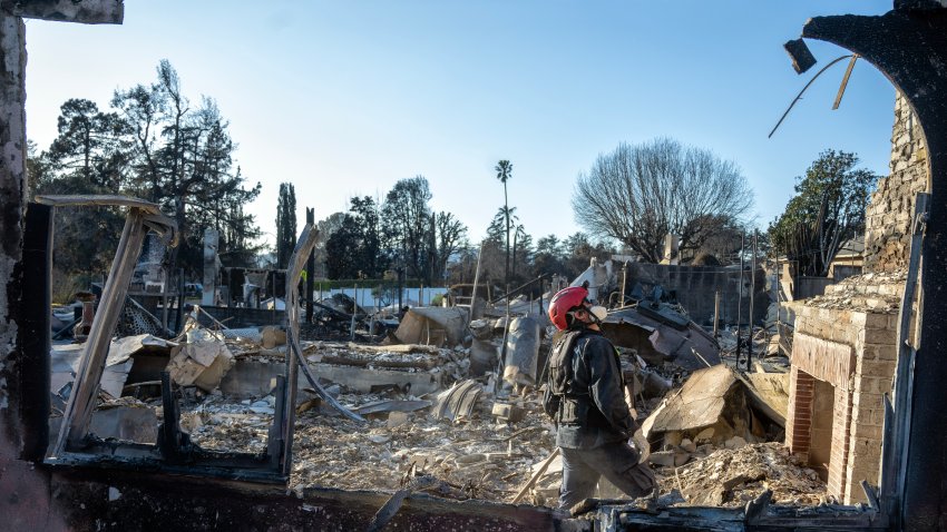 Altadena , CA – January 13: City of Santa Barbara Fire Captain Aaron Vaughn searches a burned home for victims of the Eaton Fire in Altadena on Monday, January 13, 2025. (Photo by Hans Gutknecht/MediaNews Group/Los Angeles Daily News via Getty Images)